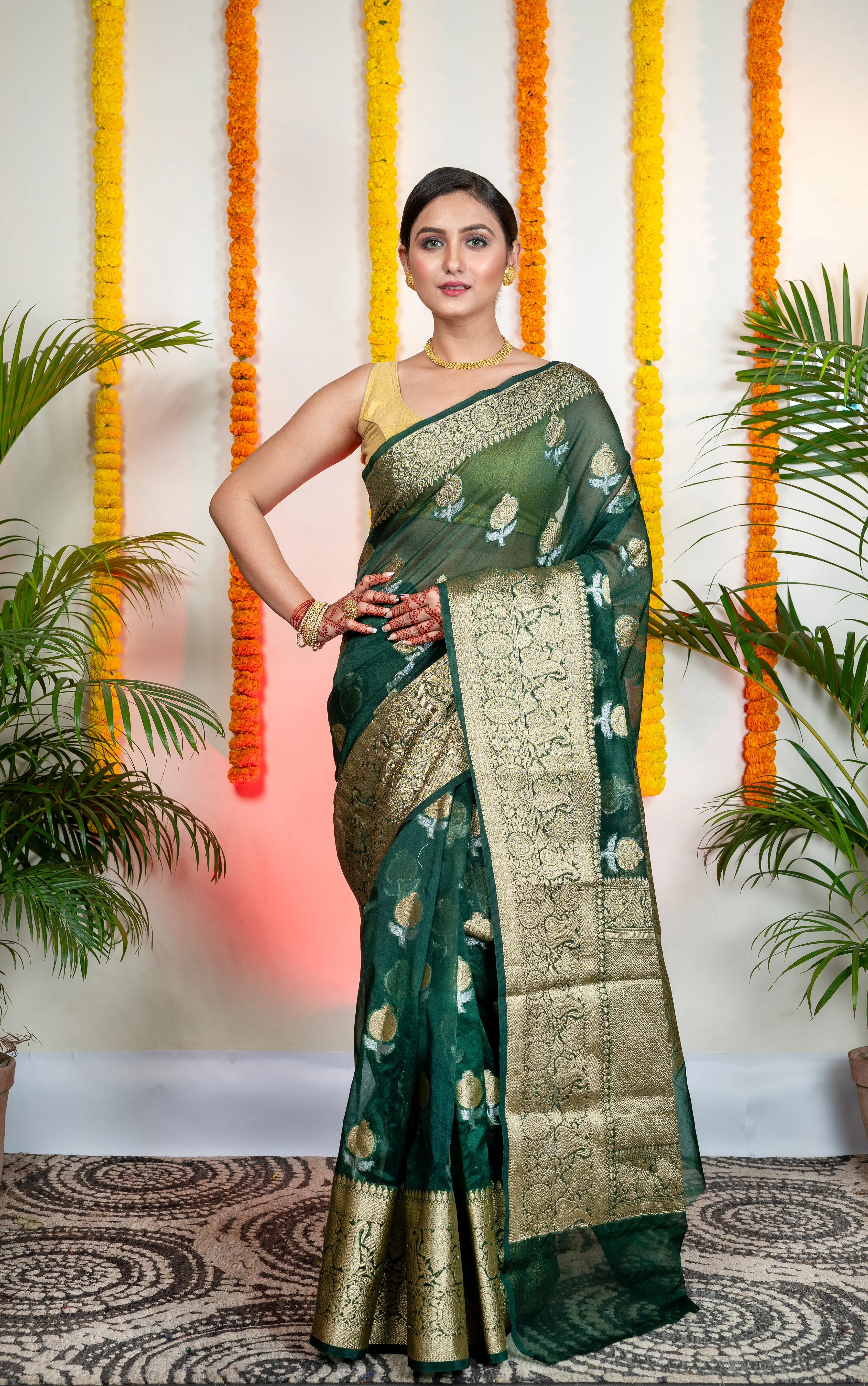 Women Green Organza Silk Saree With Zari Border And Floral Motifs